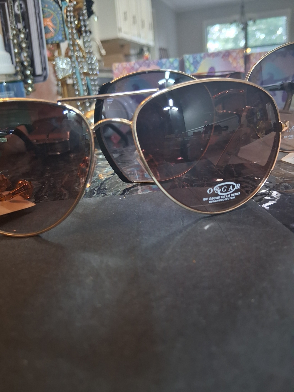 Oscar de la Renta Gold Frame Sunglasses with Blue-Tinted Lenses